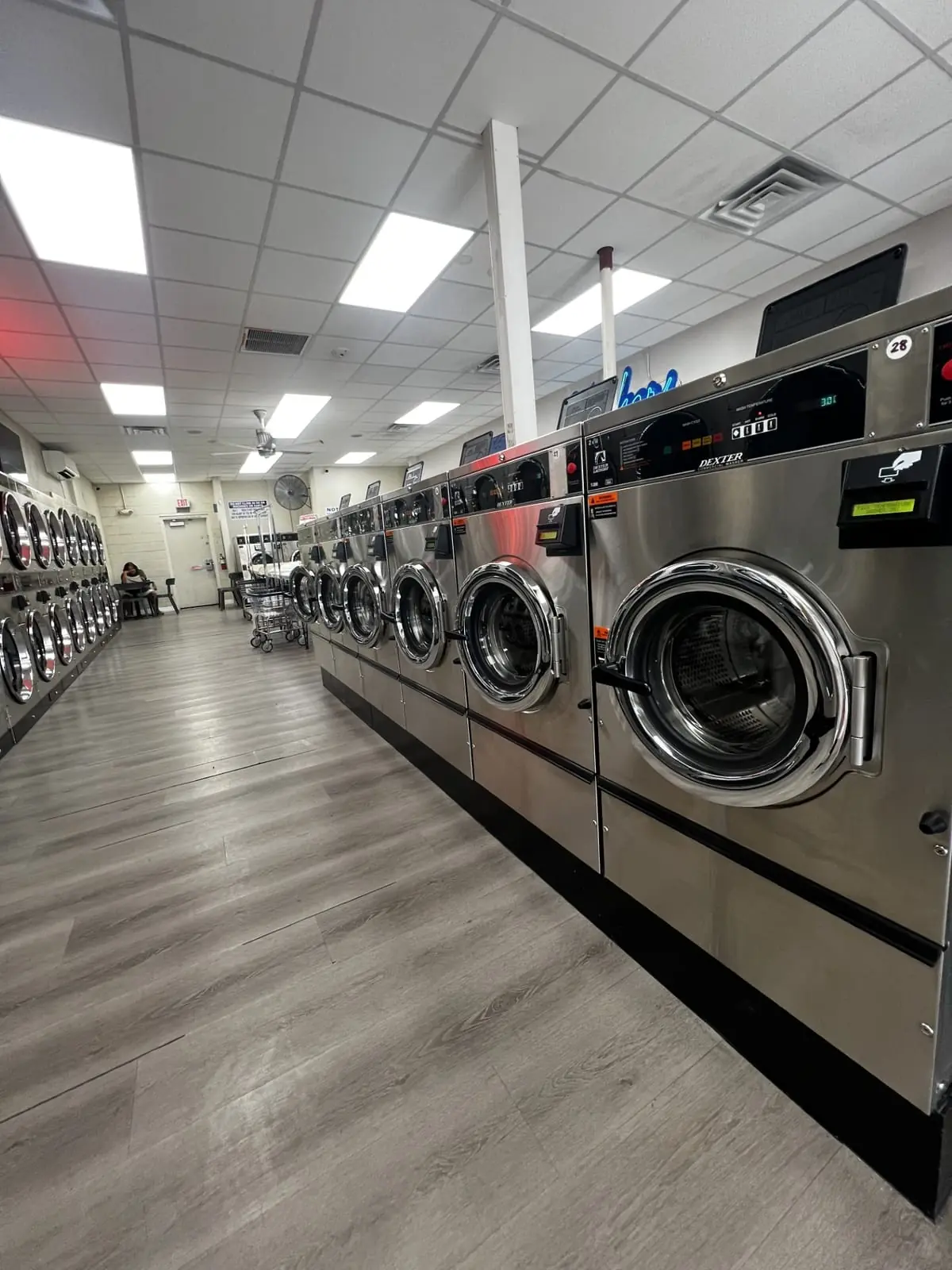 Row of Dexter commercial washers at Suds Laundromat in Surprise, Arizona